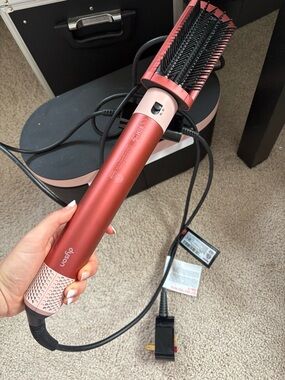 Dyson hot styling brush in coral pink and black